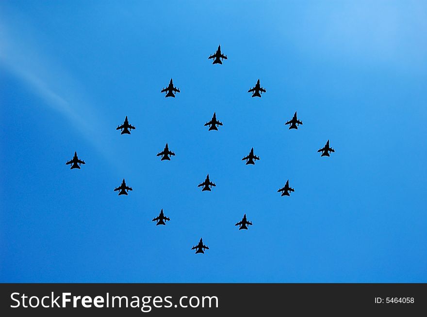 Fighter planes in formation with a clear sky background. Fighter planes in formation with a clear sky background