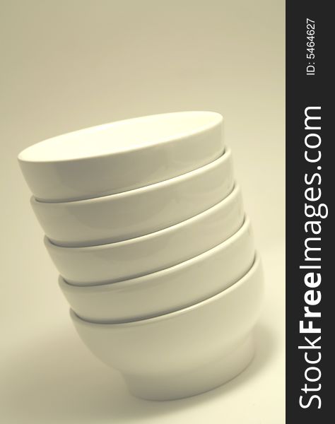 Stacked, plain white soup or cereal bowls. Stacked, plain white soup or cereal bowls