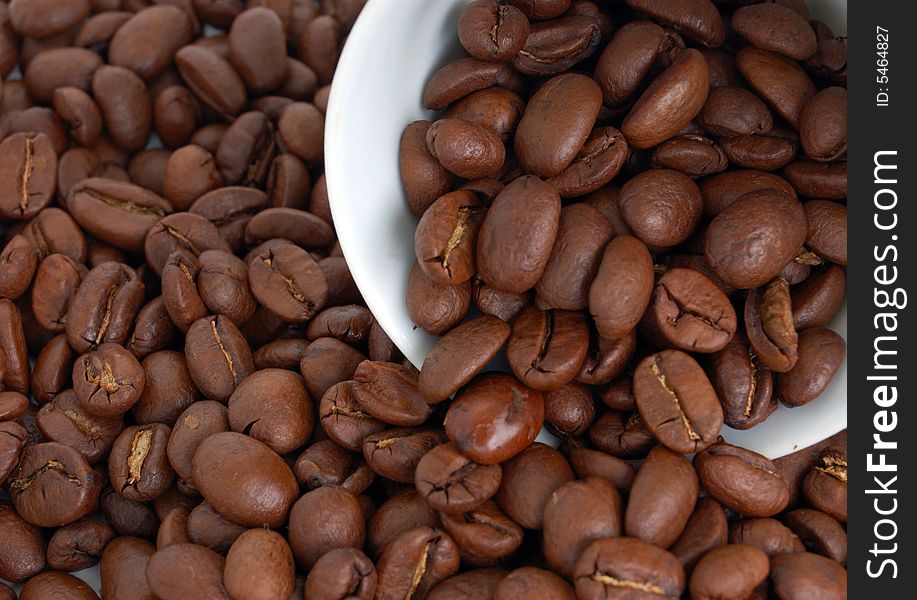 Heap of coffee beans with cap