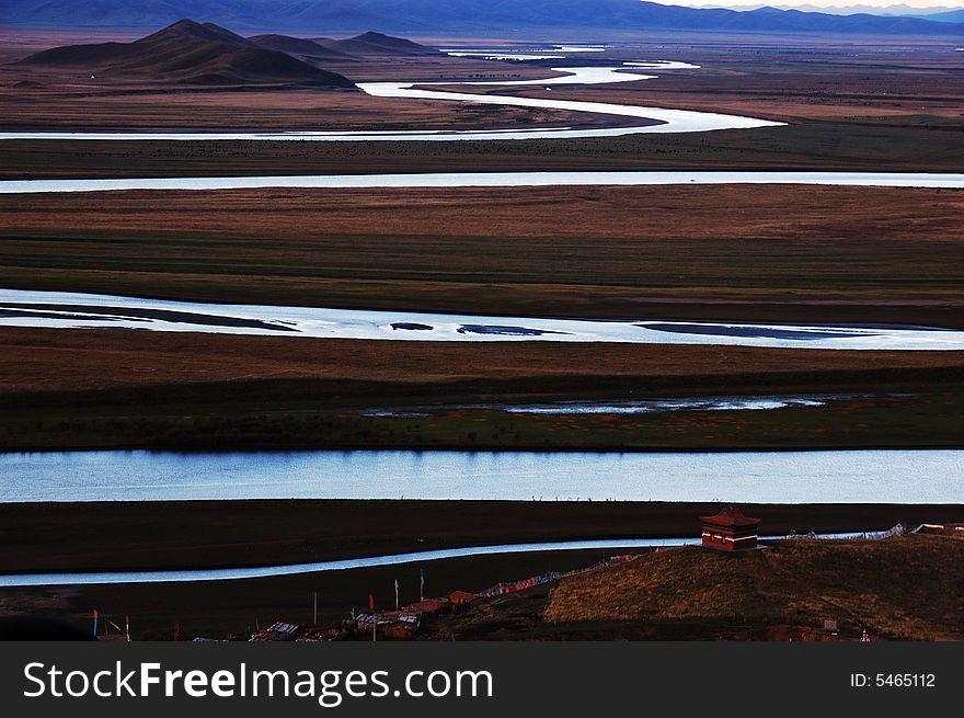 When travelling in Tibet of China in autumn,   headwaters Yellow River on the meadows appear in front of us, in darkness after sunset.