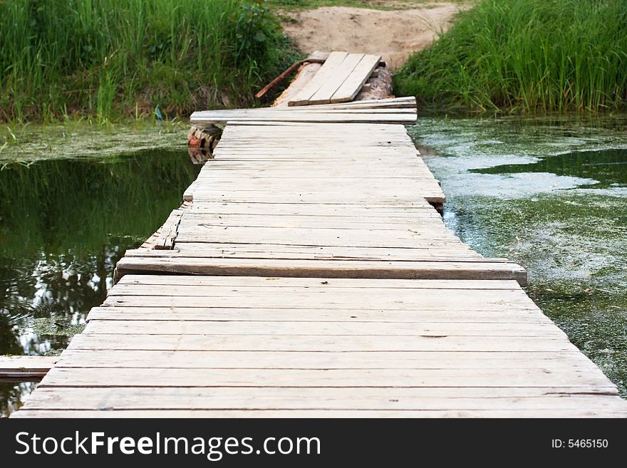 Shaky small wooden bridge, summer. Shaky small wooden bridge, summer