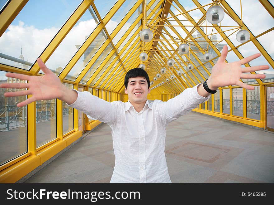 Young Asian Man Shows Salutatory Gesture