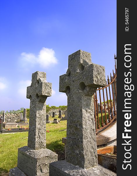 2 irish celtic crosses in an old grave yard. 2 irish celtic crosses in an old grave yard