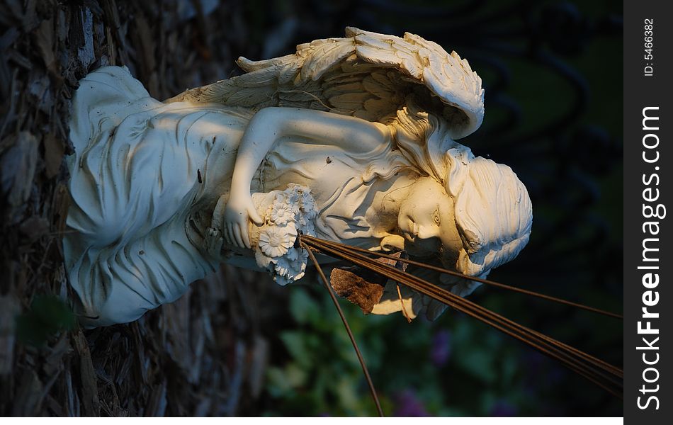 Alabaster angel statue in sunlight heavenly figure. Alabaster angel statue in sunlight heavenly figure