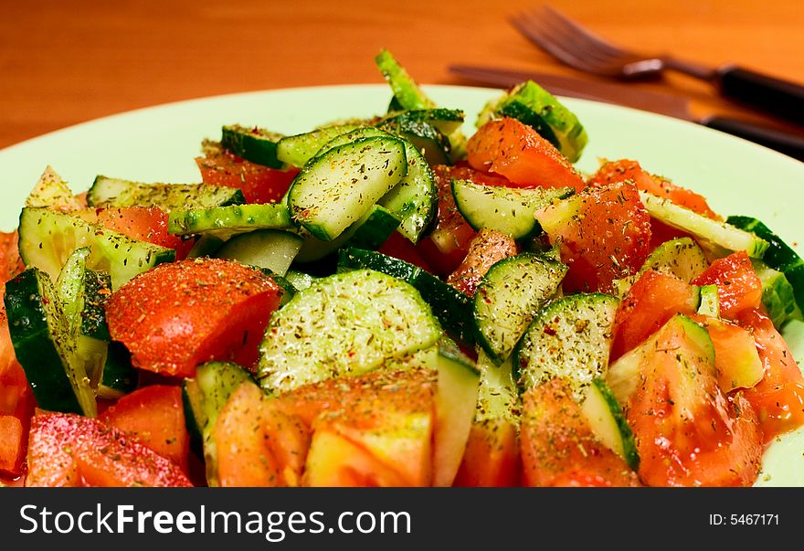 Fresh vegetable salad with spices close up