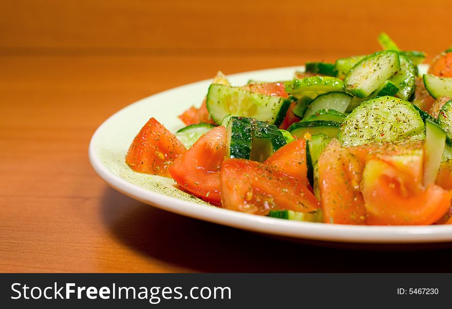 Fresh vegetable salad in plate on the table