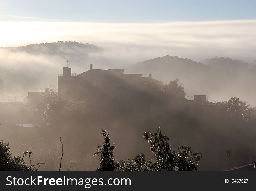 Misty morning in a village on a mediterranean island