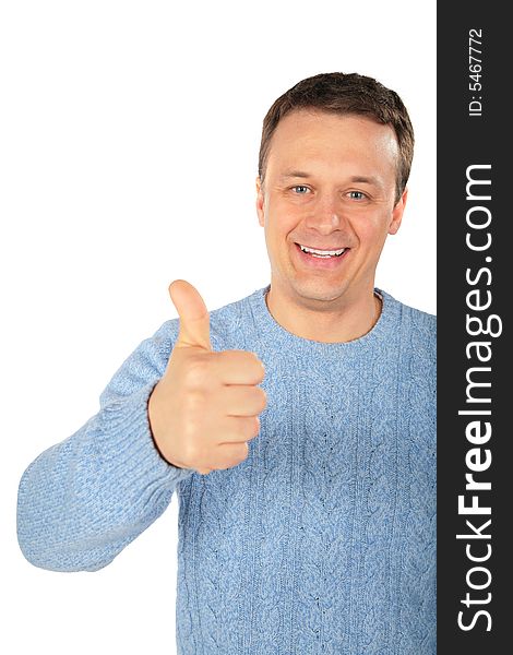 Man in a blue sweater makes gesture by finger
