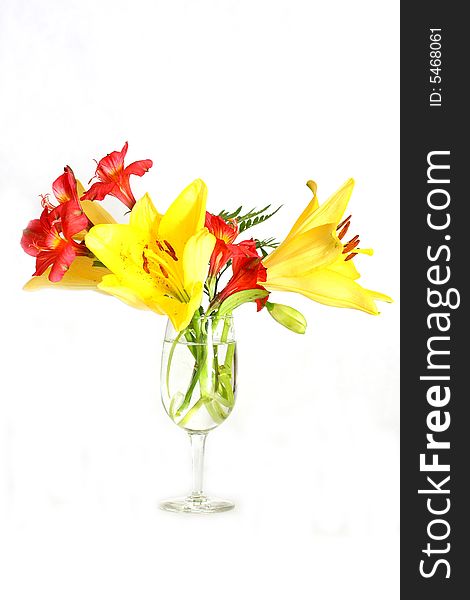 Bouquet of assorted lilies in a vase. Bouquet of assorted lilies in a vase.