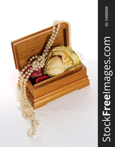 Wooden casket with dried rose and beads from pearl. Wooden casket with dried rose and beads from pearl