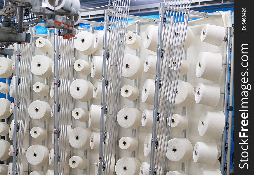 Cotton yarn spools (bobbins) in a textile factory