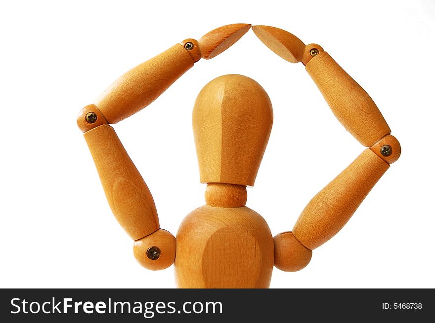 Wooden puppet holding hands like making shelter over his head. Wooden puppet holding hands like making shelter over his head