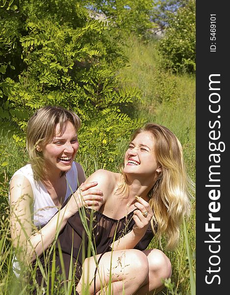 Young women at a wood, smiling, portrait