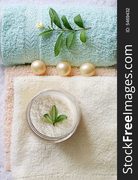 Conceptual photo with beauty items oil balls, soap, towels and nature leaves. Conceptual photo with beauty items oil balls, soap, towels and nature leaves