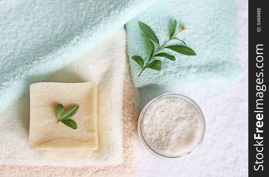 Conceptual photo with beauty items: soap, towels, and nature leaves. Conceptual photo with beauty items: soap, towels, and nature leaves