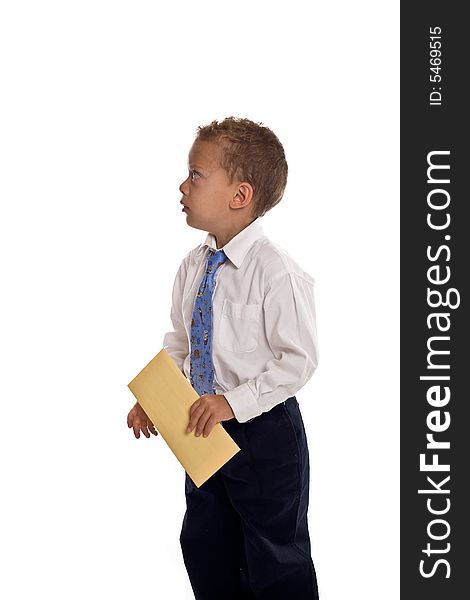 Young boy dressed as businessman holds envelope