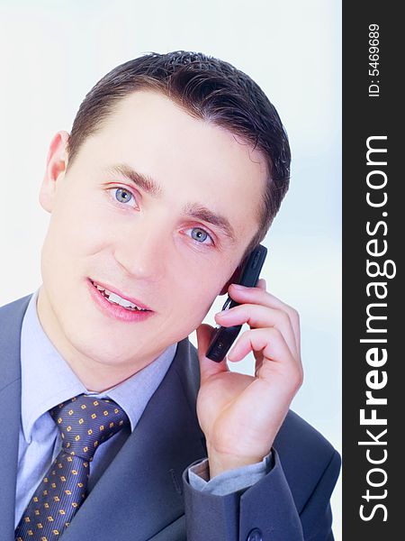 Young businessman talking on phone