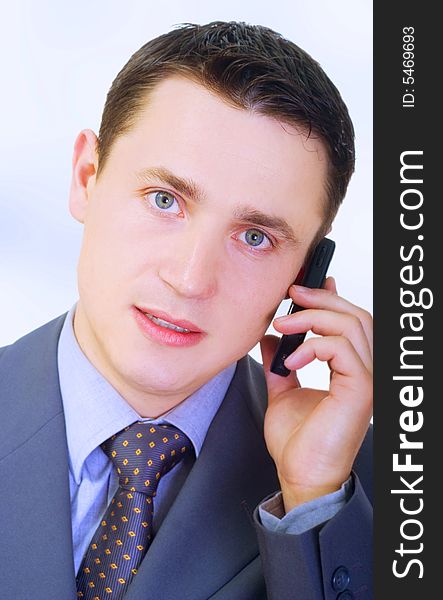 Young businessman talking on phone
