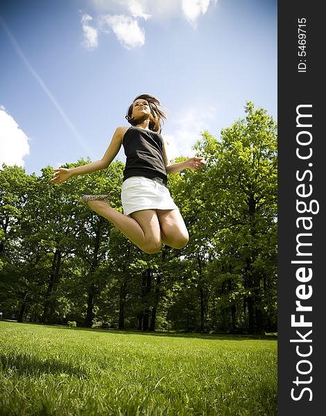 Happy Young Woman Is Jumping. Happy Young Woman Is Jumping