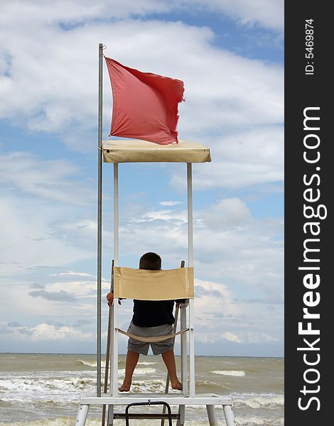 Lifeguard man watching the sea. Lifeguard man watching the sea