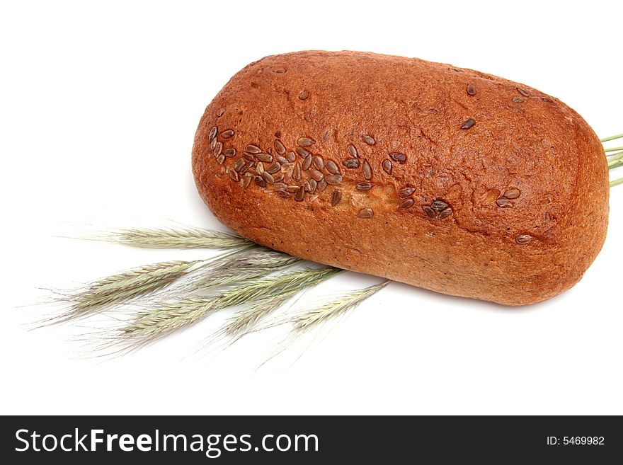 Bread with wheat ears isolated on white. Bread with wheat ears isolated on white.