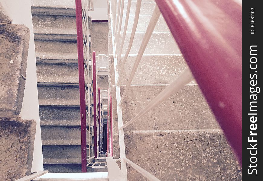 A concrete stairway in an apartment building. A concrete stairway in an apartment building.