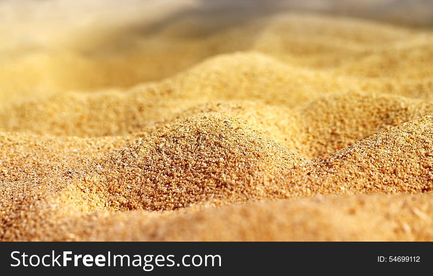 Texture of beach sand is photographed close-up