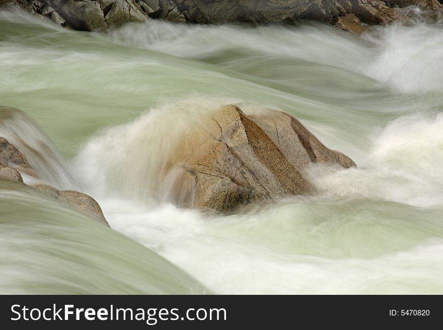 Long exposure of water flowing over rocks