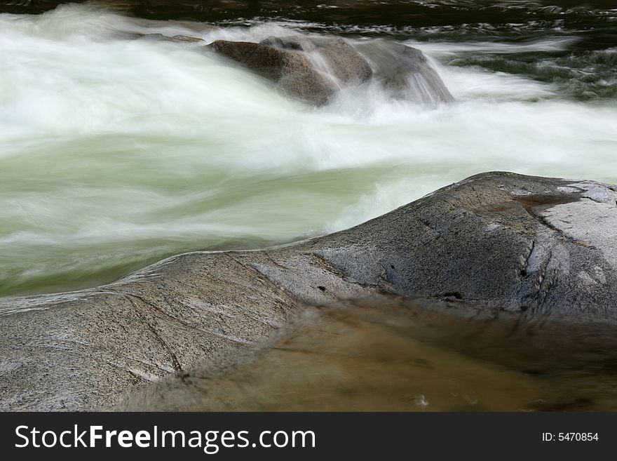 Long exposure of water flowing over rocks