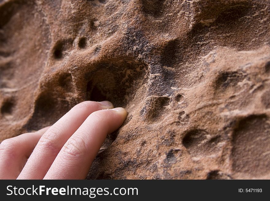 The fingers of a climber practicing in a canyon near Zion National Park, Utah. The fingers of a climber practicing in a canyon near Zion National Park, Utah.