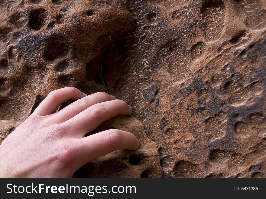 The fingers of a climber practicing in a canyon near Zion National Park, Utah. The fingers of a climber practicing in a canyon near Zion National Park, Utah.