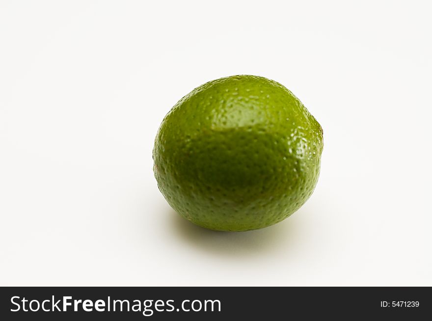 A ripe, round lime ready for summer drinks. A ripe, round lime ready for summer drinks
