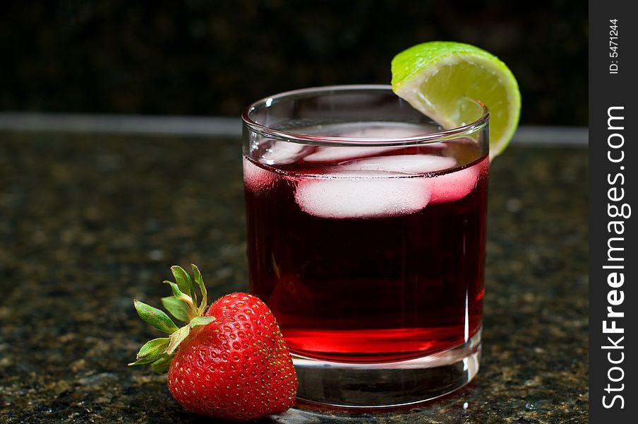 A summery drink with lime and strawberry. A summery drink with lime and strawberry