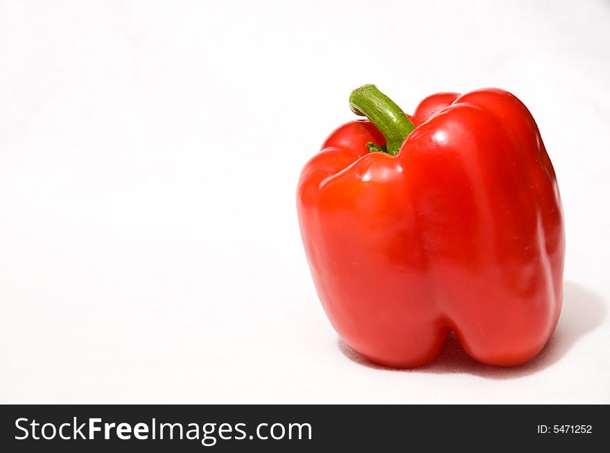 A ripe red pepper fresh from the garden. A ripe red pepper fresh from the garden