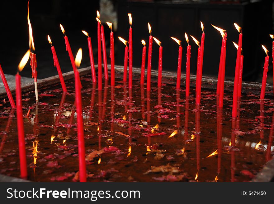 Burning candles in the water pans