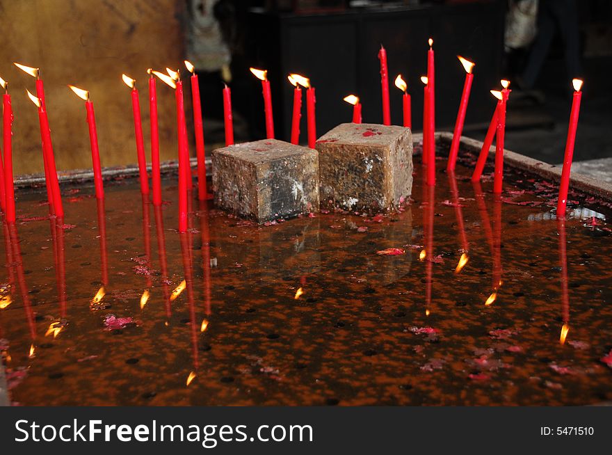 Burning candles in the water pans