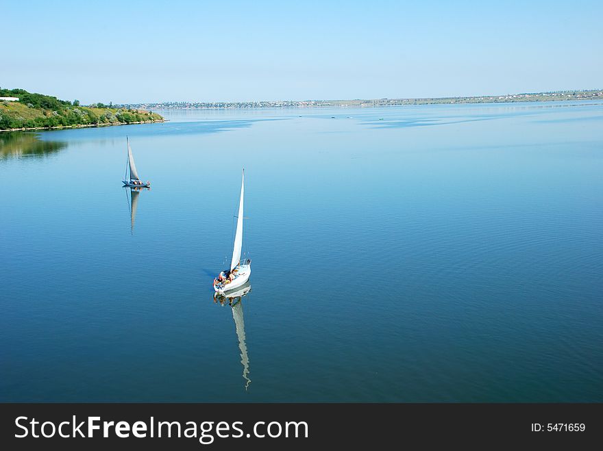Calm river scenic with yachts. bird fly view