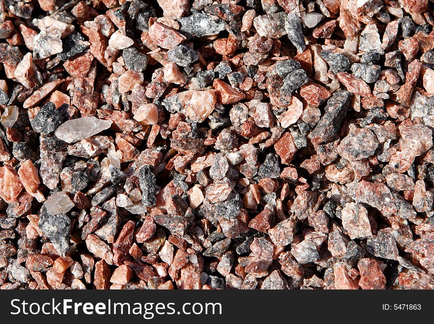 Red granite gravel photo, could be used as a texture