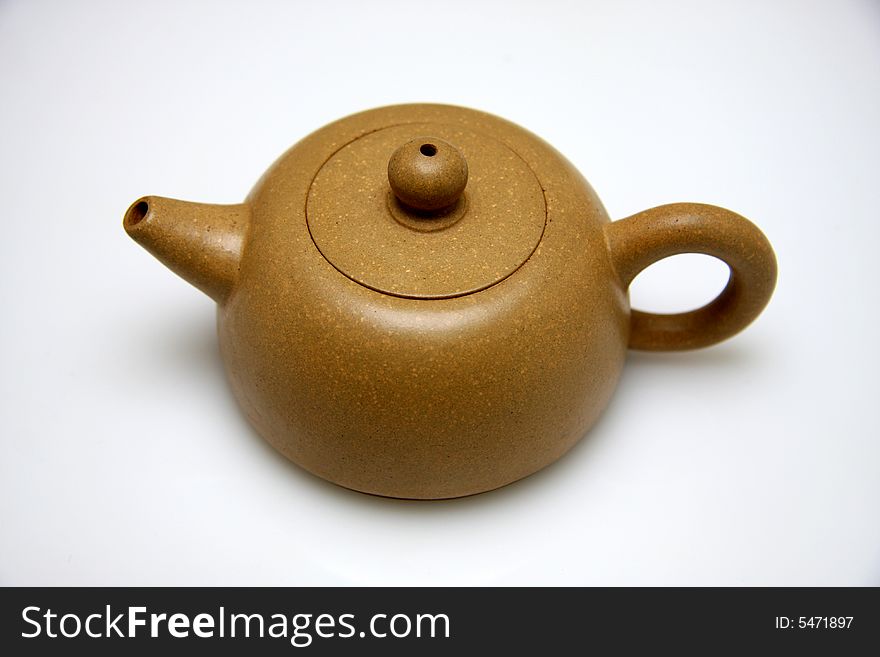 Chinese ceramic teapot with ornament on white background