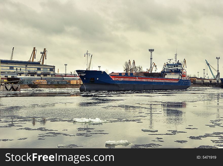 Freight ship in the dock in winter