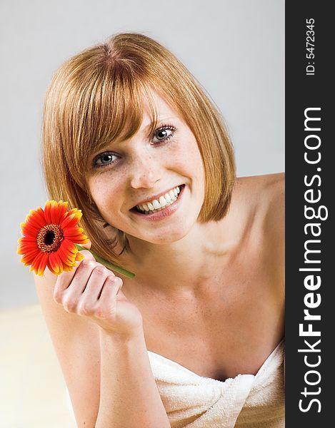 Happy Woman In A Spa With Flower