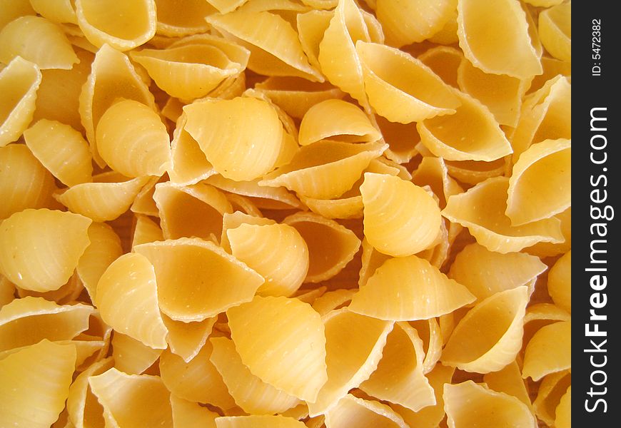 A close up for a bunch of pasta shell