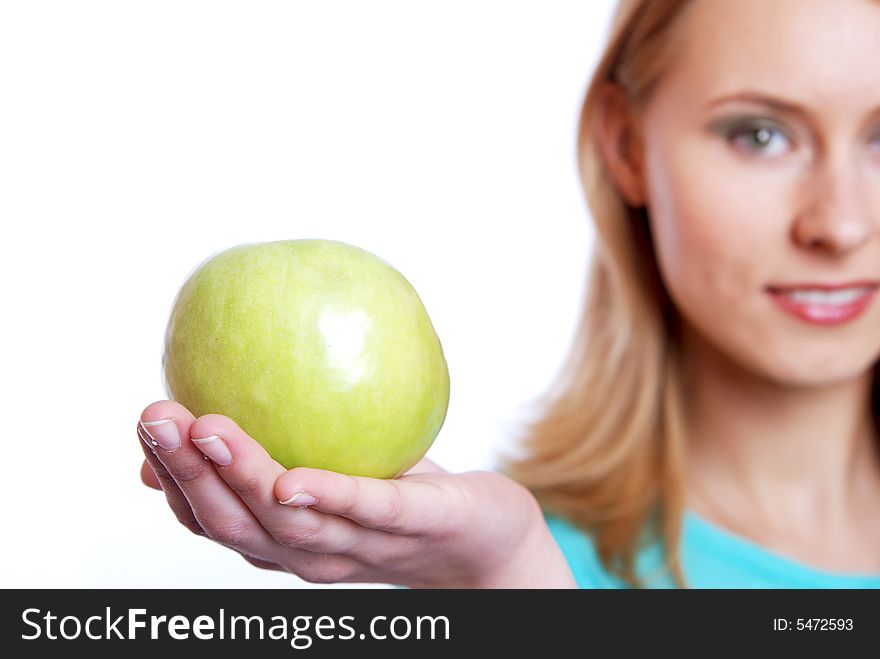 The girl with a green apple on a white background