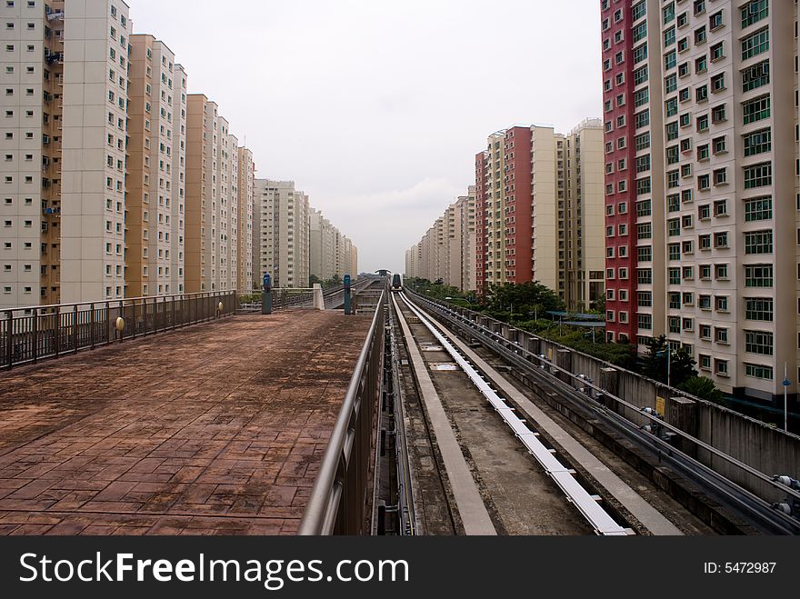 Railways, providing mass transportion, through HDB area, where millions of people live