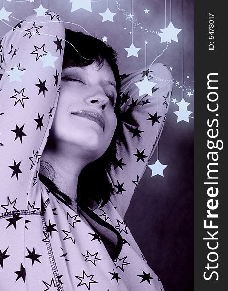 Pretty sleepy woman in a pijamas with stars. Pretty sleepy woman in a pijamas with stars