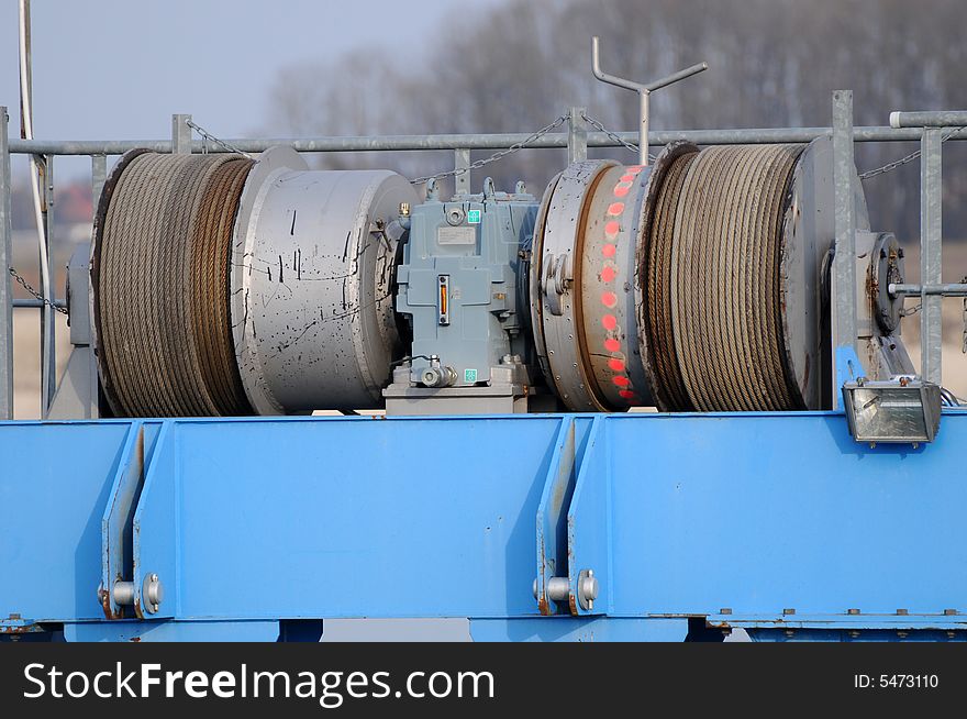 A detailview of a dredger in a gravel pit. A detailview of a dredger in a gravel pit.