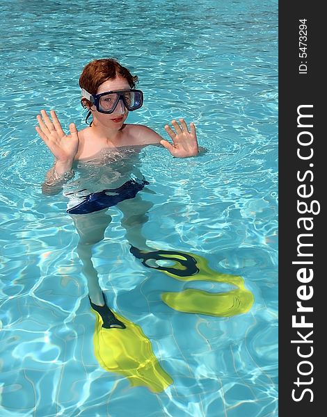 Boy diver in the swimming pool