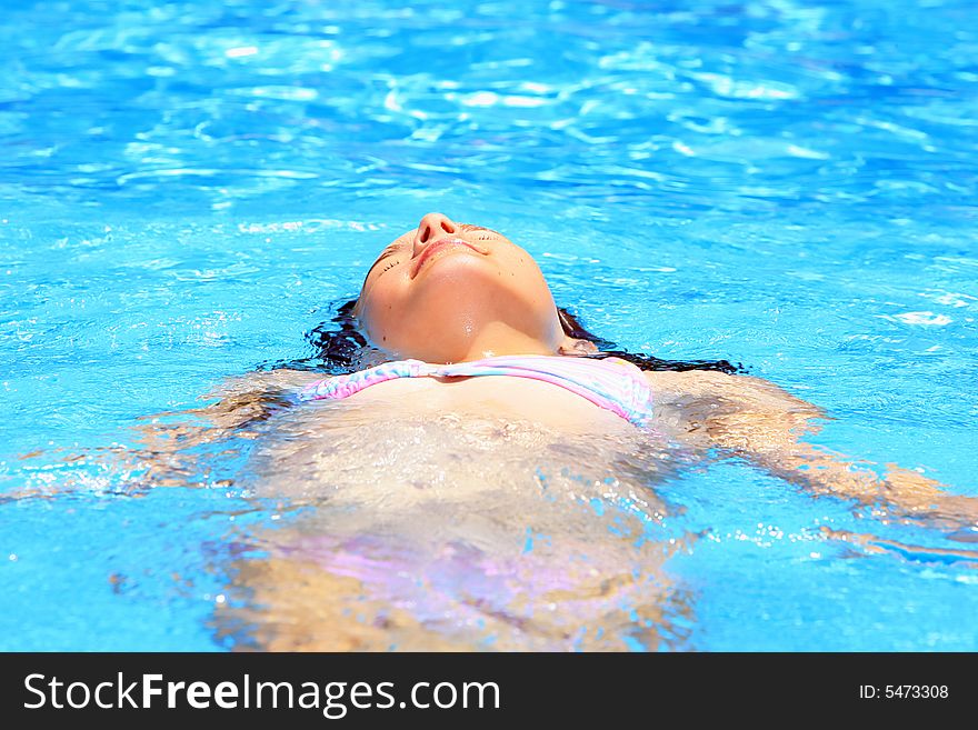 Girl lying  in the water