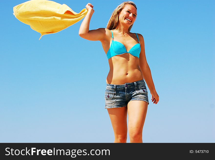 Young attractive woman enjoying summertime on the beach. Young attractive woman enjoying summertime on the beach