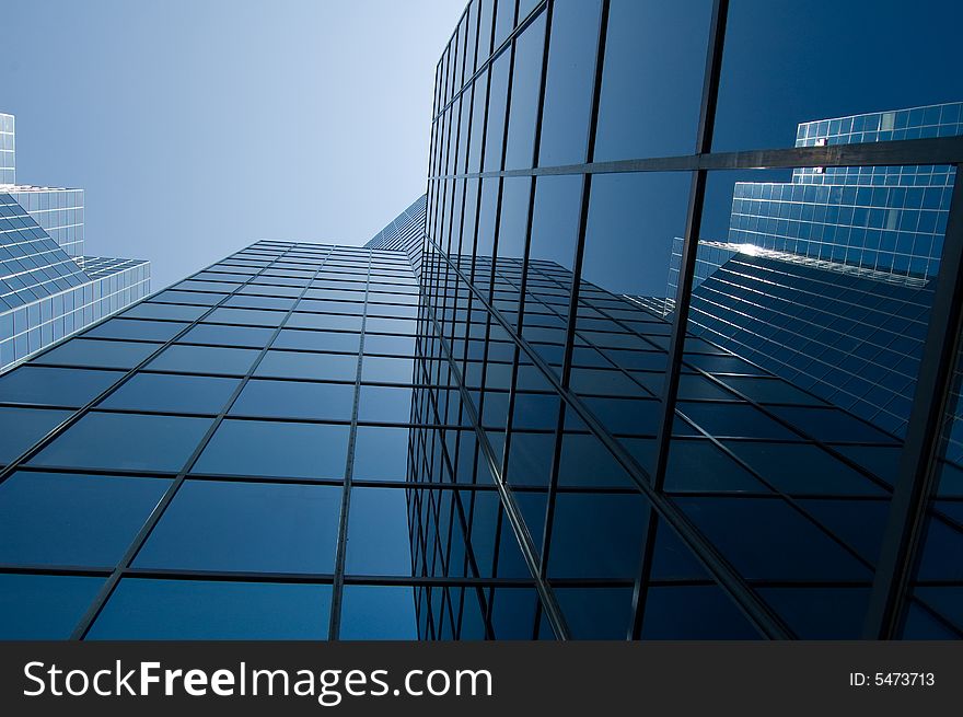 View of a modern downtown office buildingwith reflective window. View of a modern downtown office buildingwith reflective window